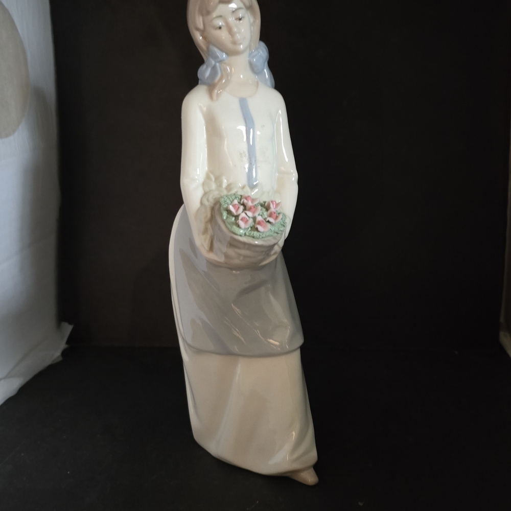 Elegant Figurine with Floral Basket